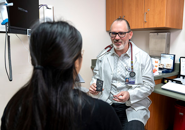 Dr. Lancaster in office with a patient