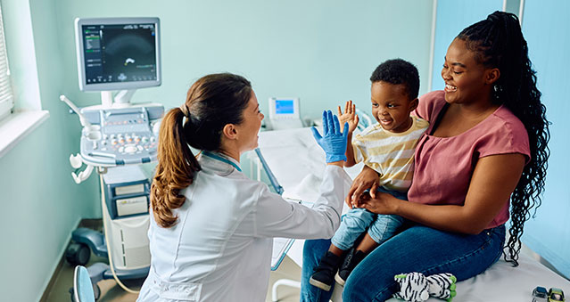 Parent and child meets with a pediatrician.
