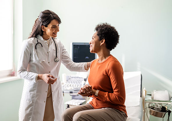 A woman at the doctor's office checking for signs of lupus.